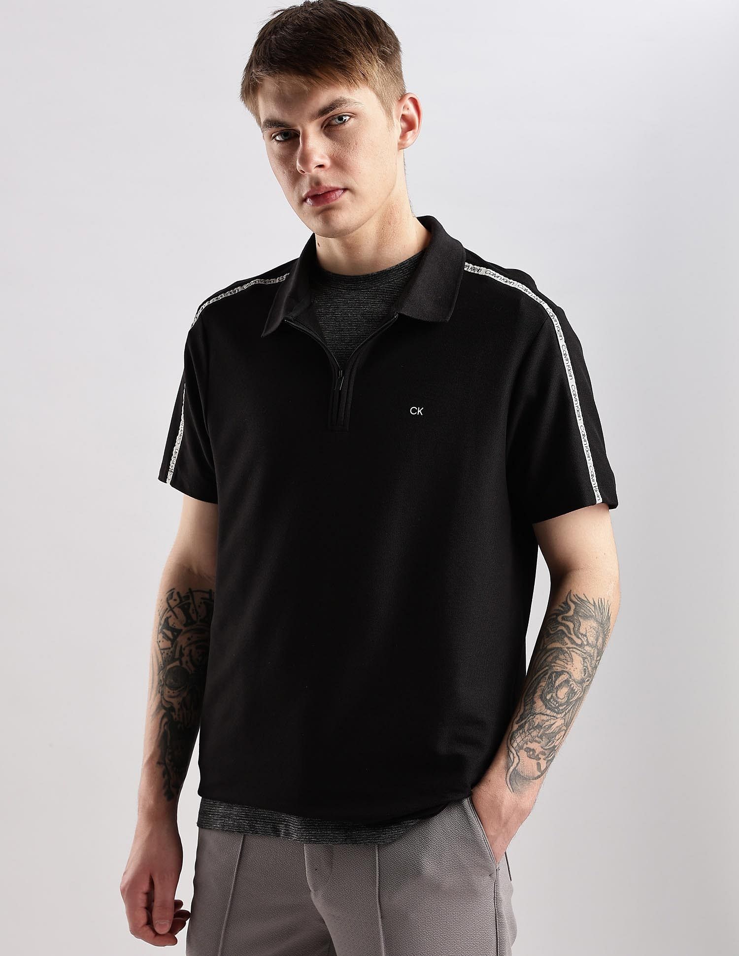 Calvin Klein Jeans Mens Black Solid Polo Shirts