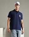 Tommy Hilfiger Solid Regular Fit Cotton Polo T-Shirt